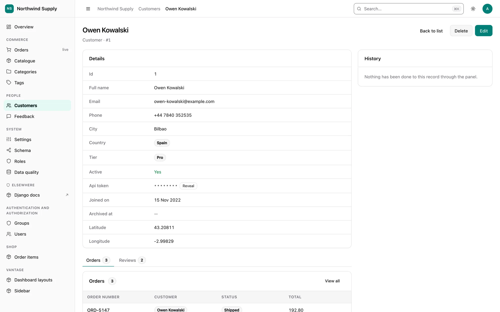 An API token masked with a Reveal button